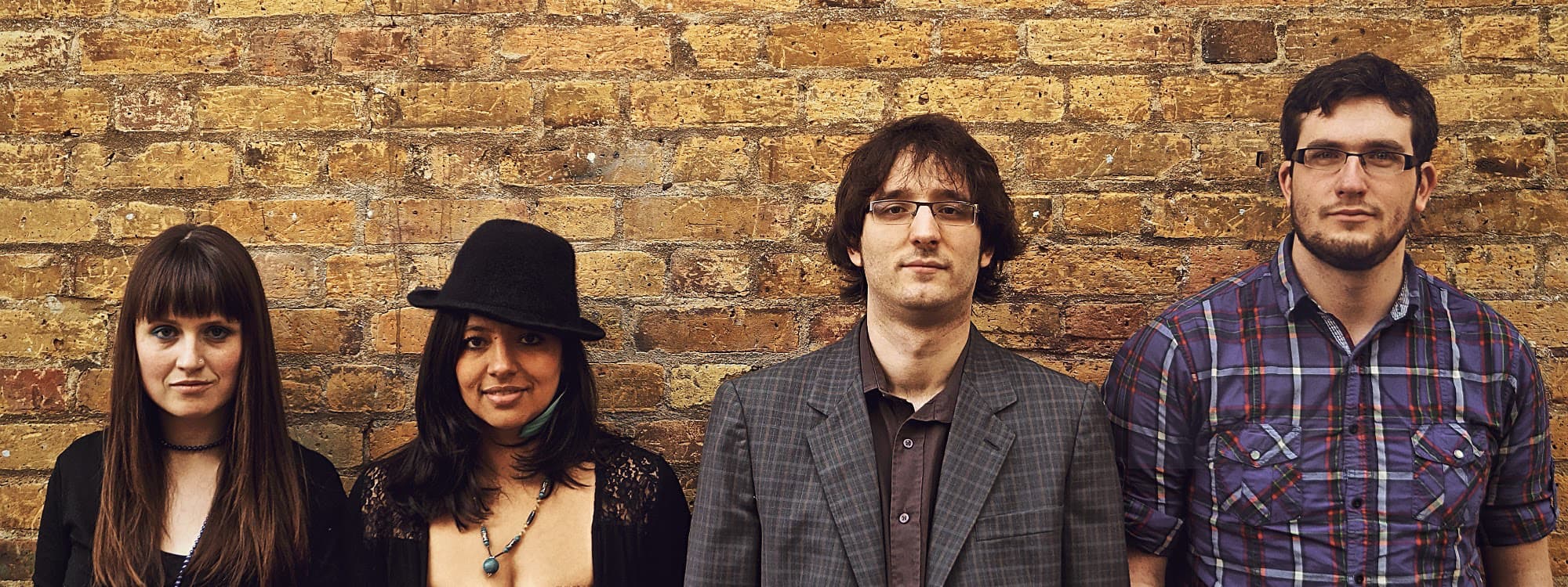 Quartet Volute against a wall